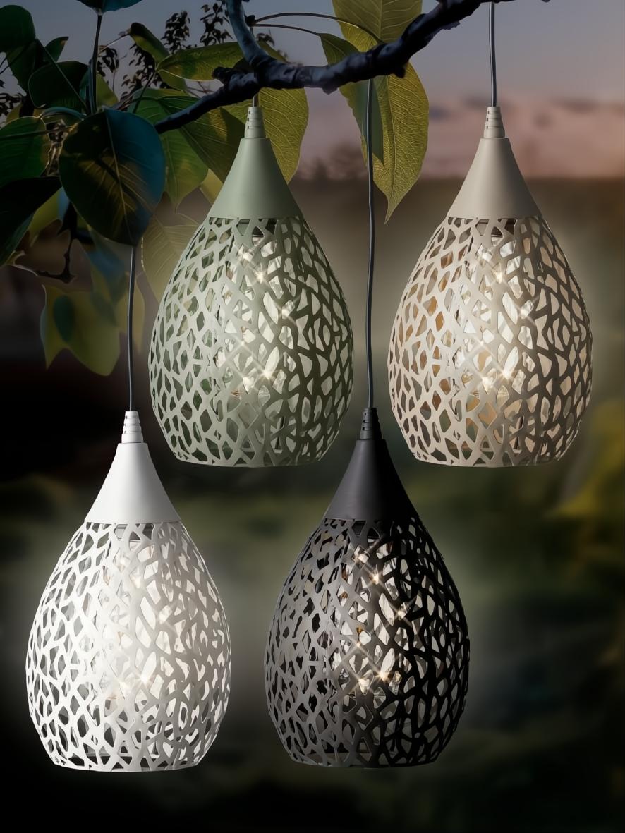 Four teardrop-shaped solar hanging lights in assorted colors (white, black, olive, beige) with intricate cut-out patterns.